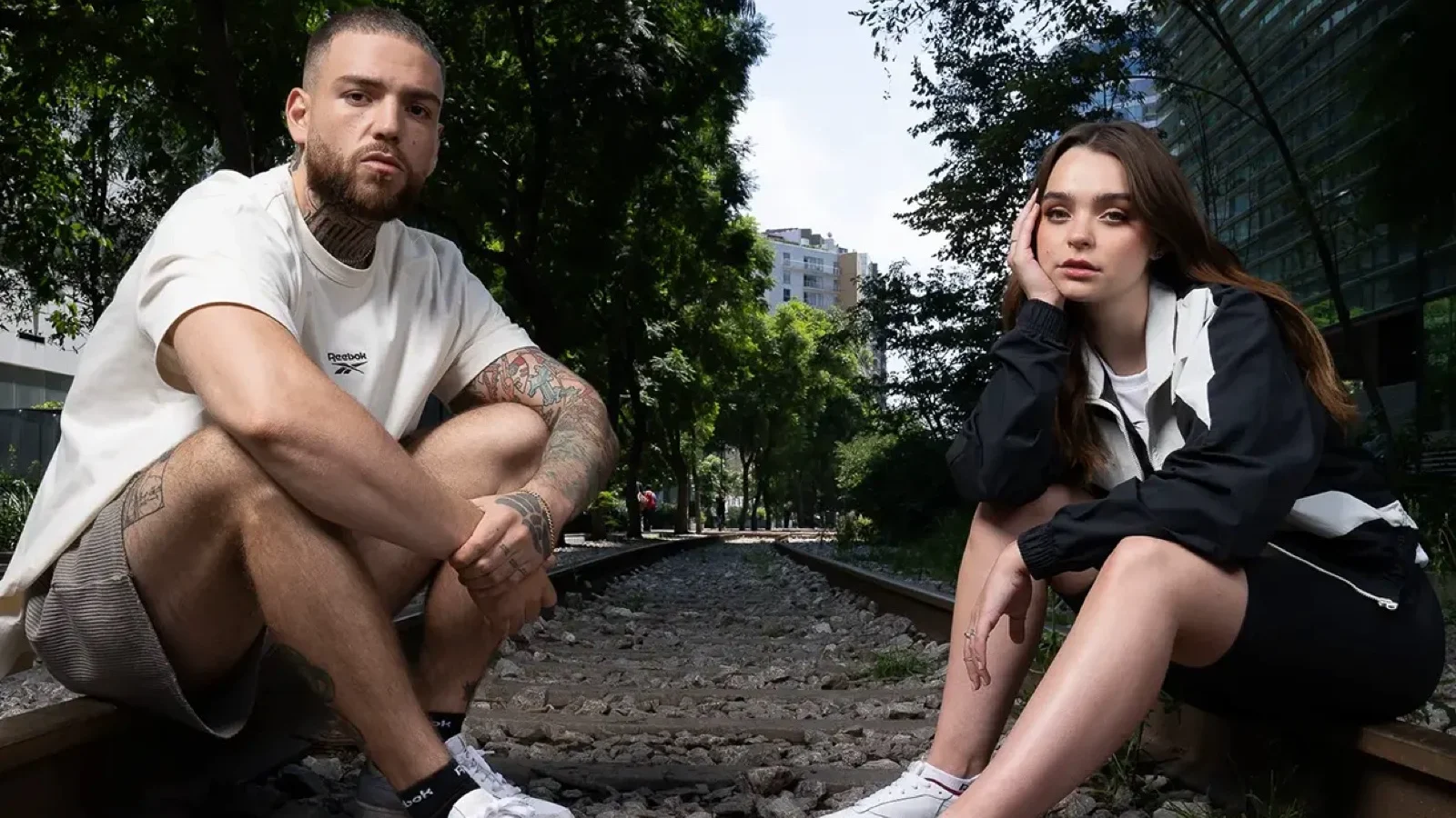 Campaign photography for Reebok by ZerezoFilms: couple in sportswear on railway tracks