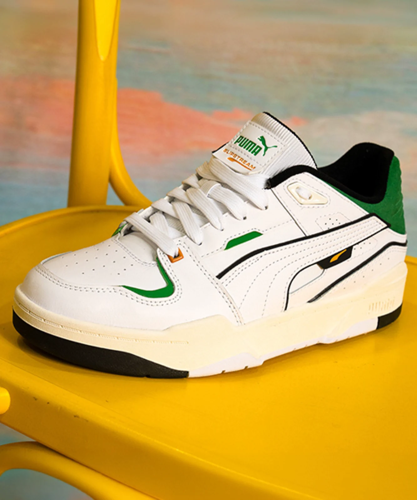 Still from a product spot produced by ZerezoFilms: Puma Slipstream sneaker on a yellow chair