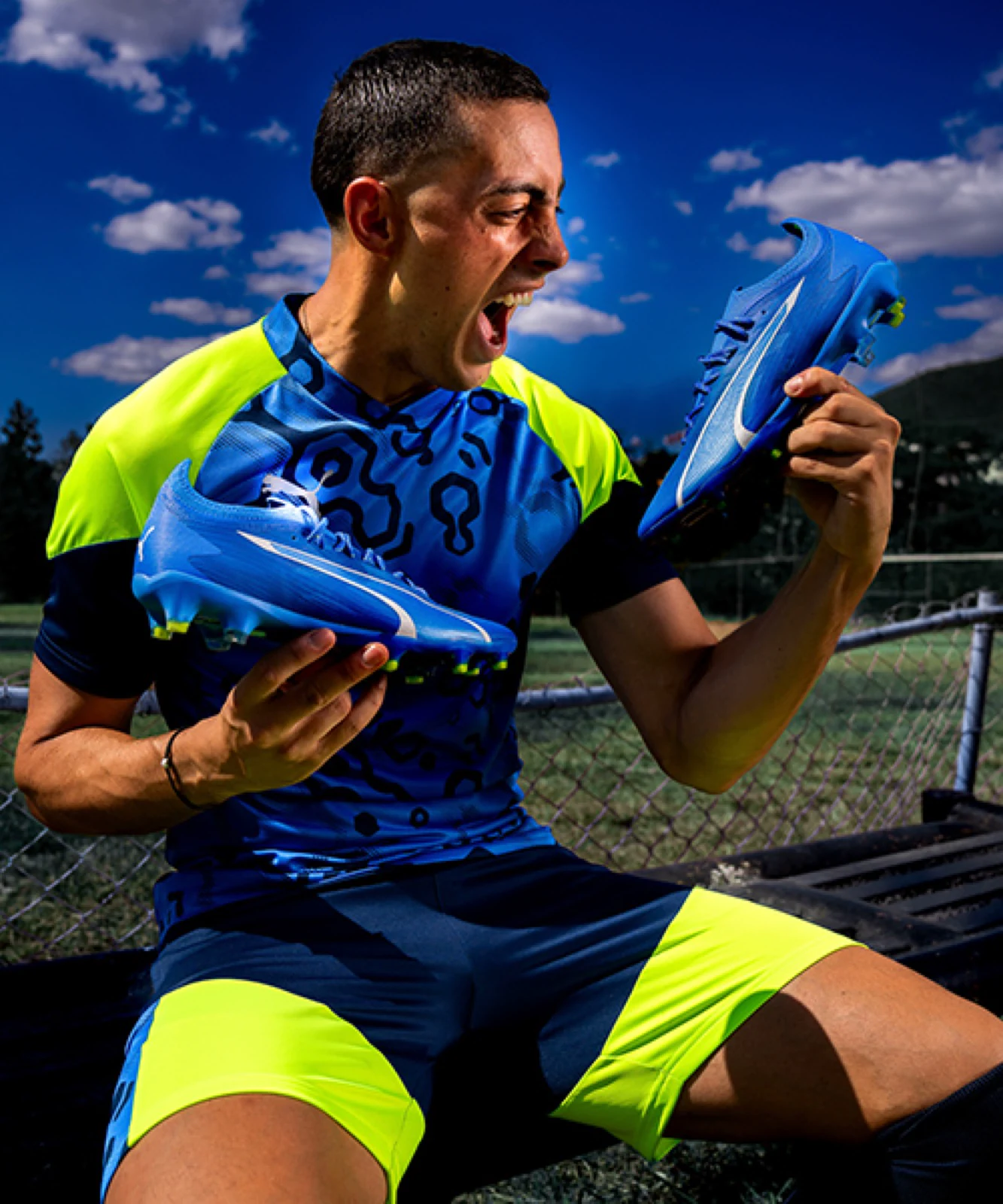 Still from the Puma ULTRA spot produced by ZerezoFilms: footballer celebrating with the blue boots in hand