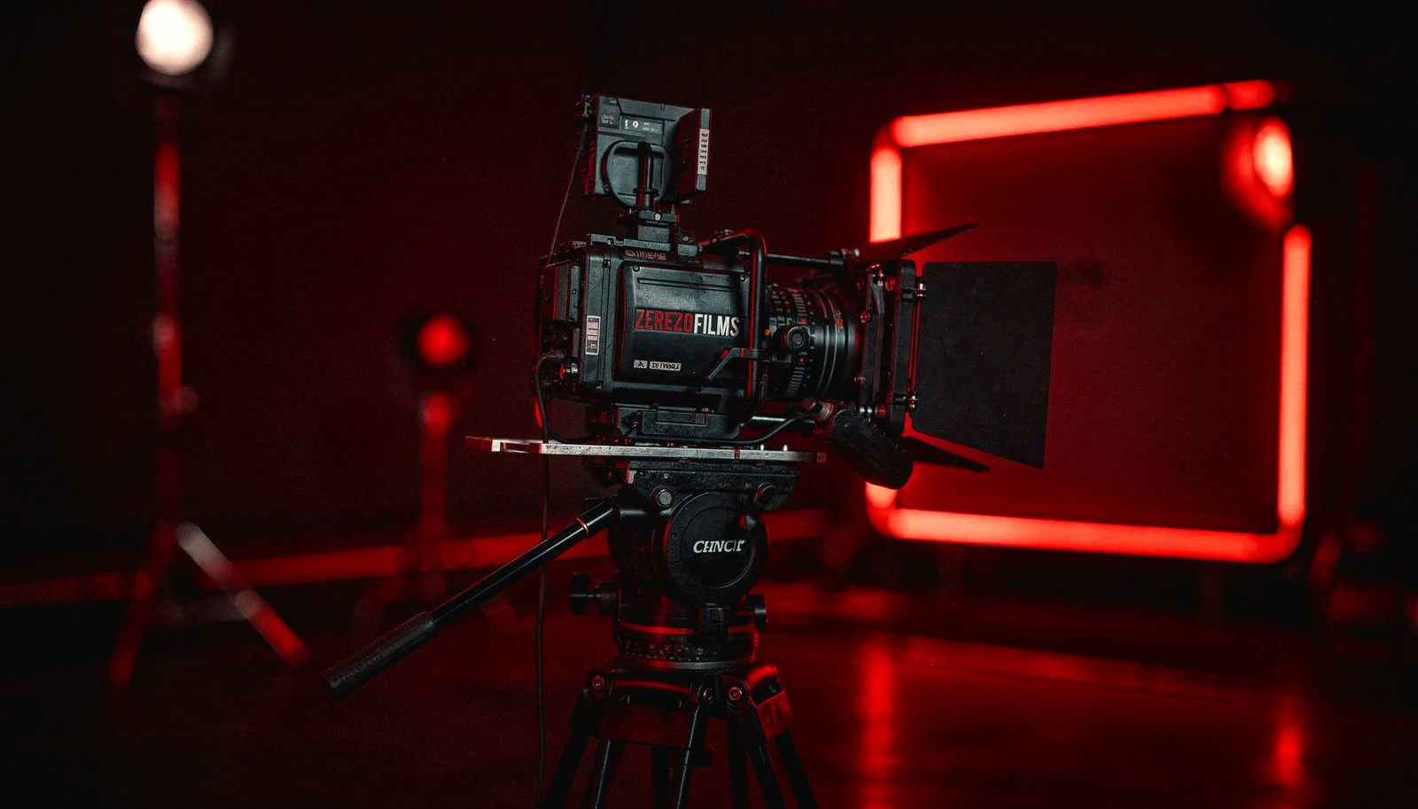 ZerezoFilms digital content production set: professional cinema camera in studio with red lighting